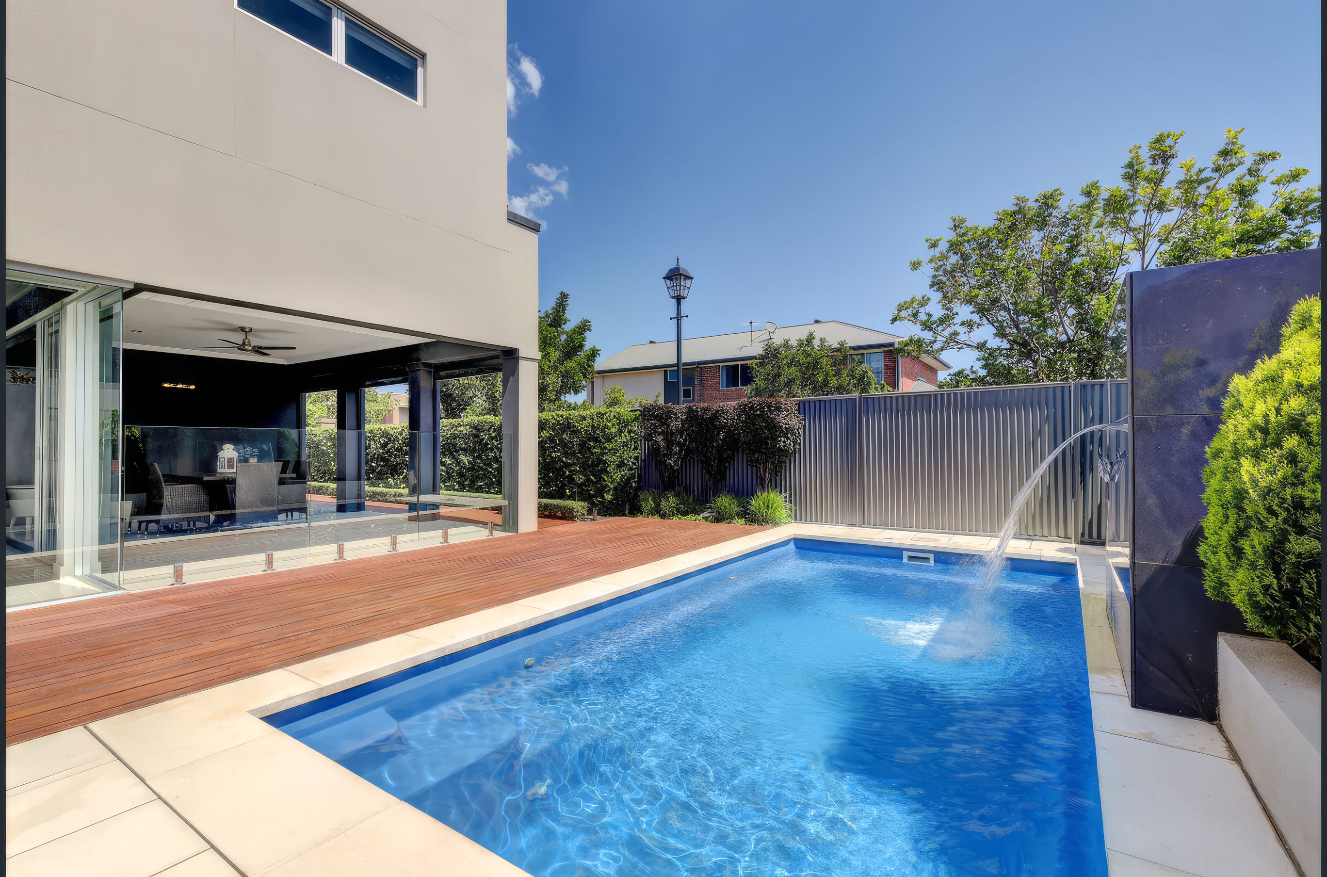 Al fresco pool with water feature